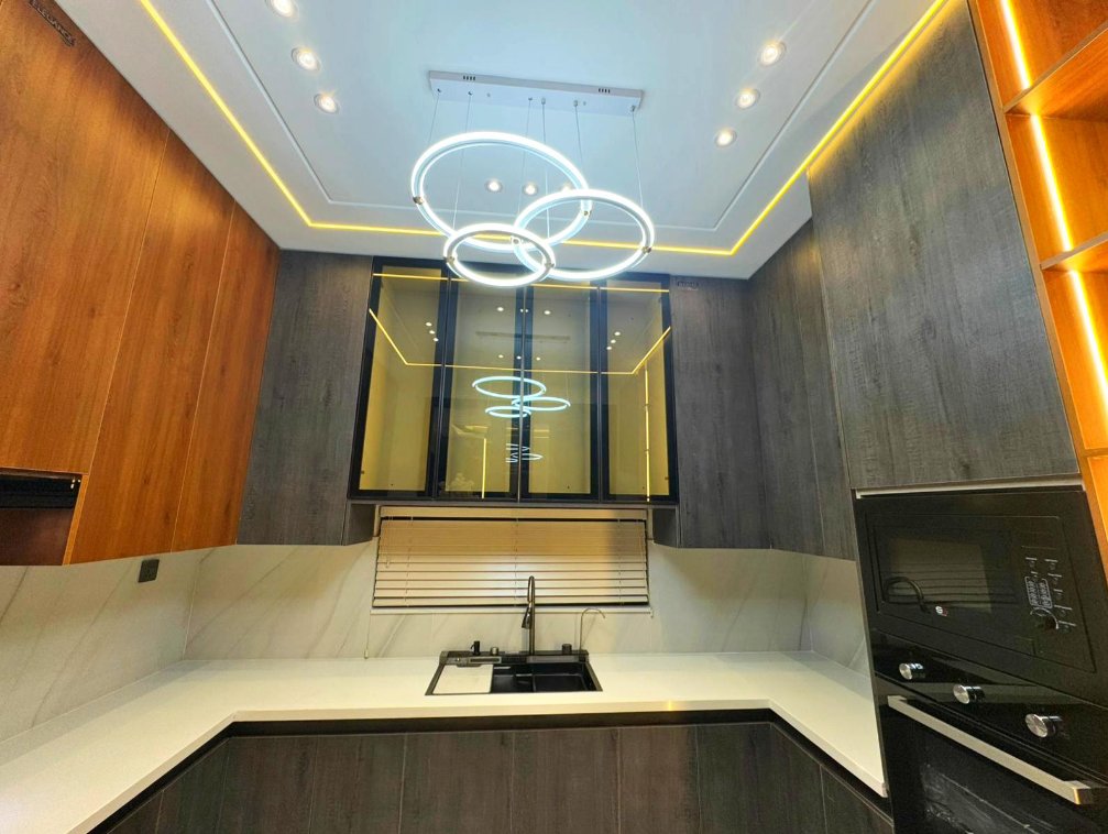 Modern kitchen with ring pendants